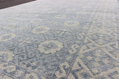 Vintage Khotan Rug in White and Blue. Measures: 9'2 x 12'1. This superb woolen Khotan hailing from India features an all over design with geometric shapes and patterning enclosed within a complementary border. The rug is rendered in shades of whi... - Keivan Woven ArtsIN - JAI - 5385 - 6967Rug