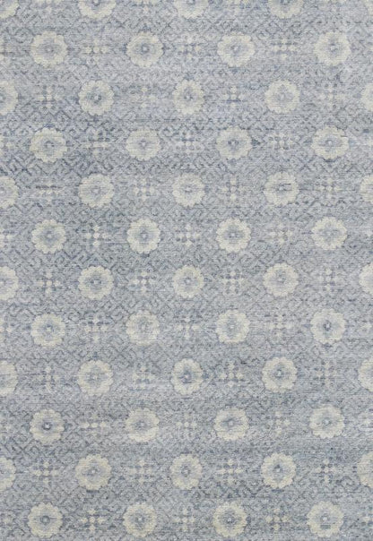 Vintage Khotan Rug in White and Blue. Measures: 9'2 x 12'1. This superb woolen Khotan hailing from India features an all over design with geometric shapes and patterning enclosed within a complementary border. The rug is rendered in shades of whi... - Keivan Woven ArtsIN - JAI - 5385 - 6967Rug