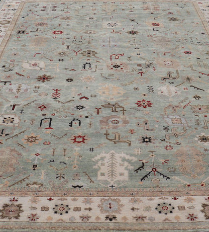 Indian Hand - Knotted Wool Oushak Rug in Turquoise, Cream, and Red Measures 9'11 x 13'6 Country of Origin: India; Type: Oushak; Design: All - Over, Floral; Keivan Woven Arts: rug IN - PRA - 1114; Indian Hand - Knotted Wool Oushak Rug in Tur... - Keivan Woven ArtsIN - PRA - 1114 - 15434