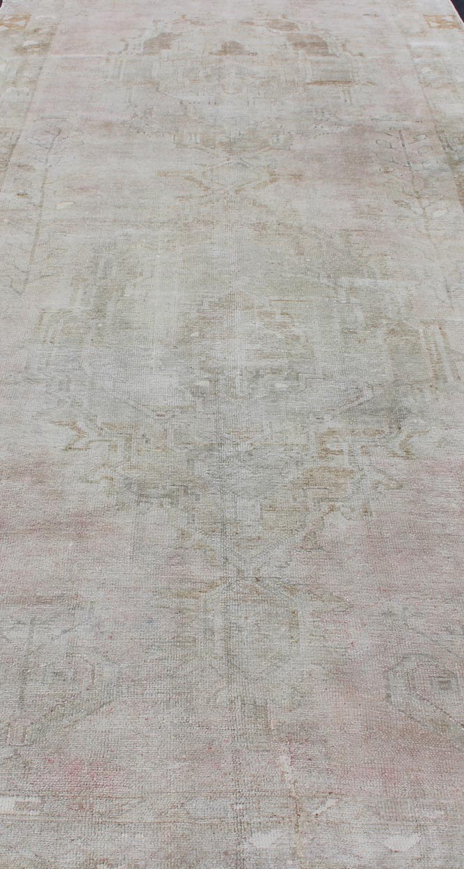 Oushak carpet antique from Turkey with subdued tones and design, rug IS - 110, country of origin / type: Turkey / Oushak, circa 1930 This long and beautiful antique Turkish Oushak rug possesses two stretched palmette medallions and an overall Sub - ... - Keivan Woven ArtsIS - 110 - 848Rug