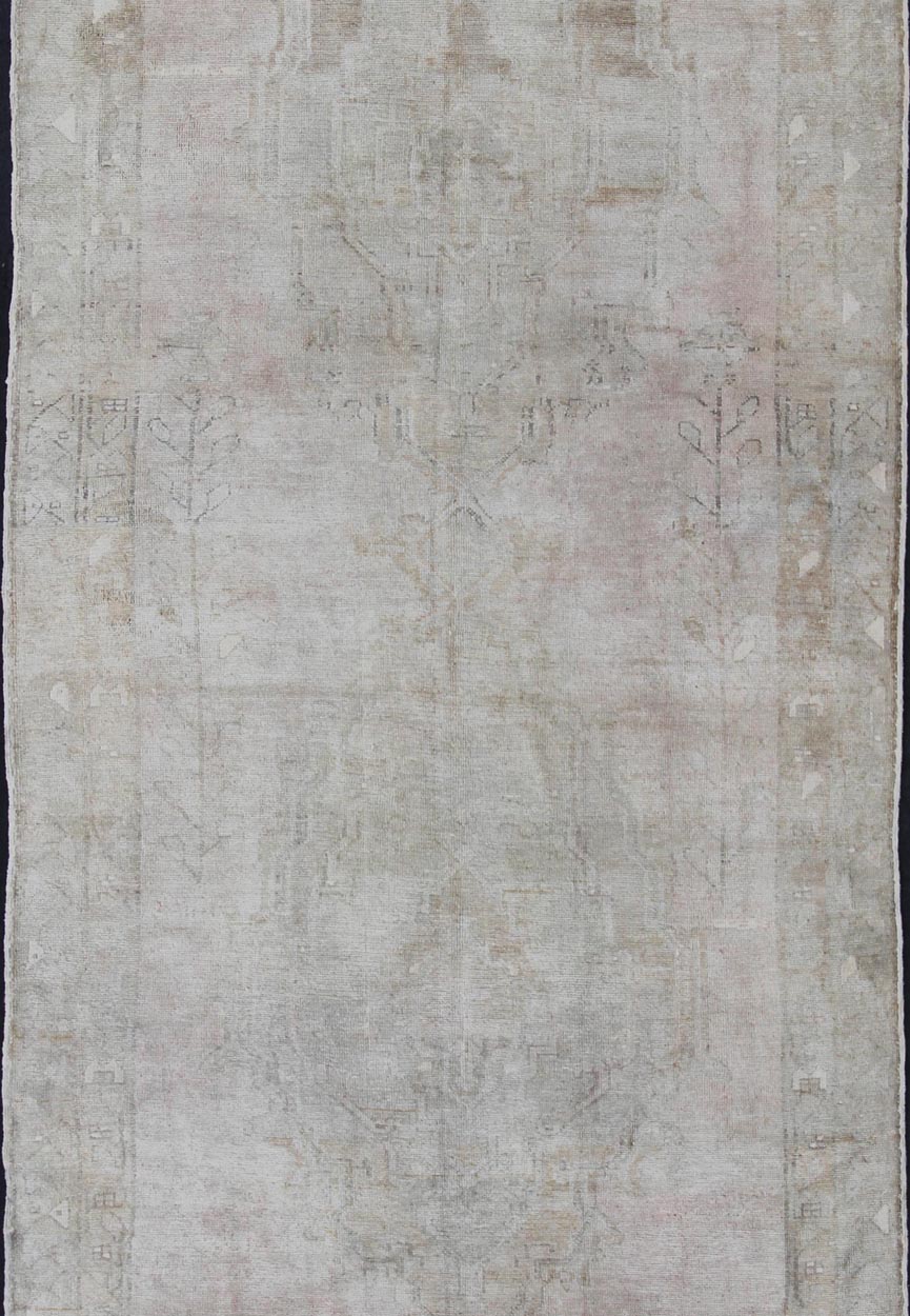 Oushak carpet antique from Turkey with subdued tones and design, rug IS - 110, country of origin / type: Turkey / Oushak, circa 1930 This long and beautiful antique Turkish Oushak rug possesses two stretched palmette medallions and an overall Sub - ... - Keivan Woven ArtsIS - 110 - 848Rug