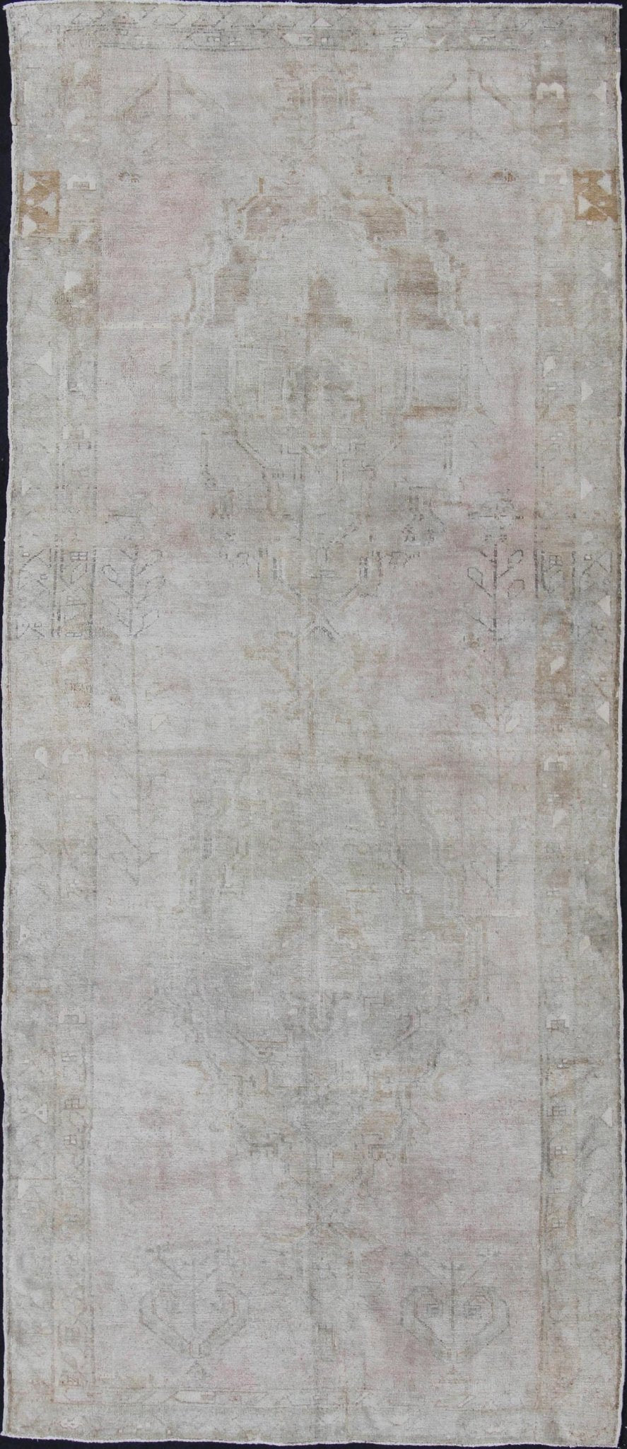 Oushak carpet antique from Turkey with subdued tones and design, rug IS - 110, country of origin / type: Turkey / Oushak, circa 1930 This long and beautiful antique Turkish Oushak rug possesses two stretched palmette medallions and an overall Sub - ... - Keivan Woven ArtsIS - 110 - 848Rug