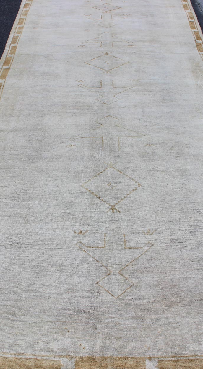 Midcentury vintage Turkish Oushak rug with tribal design in muted tones, rug is - 132, country of origin type: Turkey Oushak, circa mid - 20th century. This Turkish Oushak runner features a multi - medallion tribal design as well as patterns of smalle... - Keivan Woven ArtsIS - 132 - 1462Rug