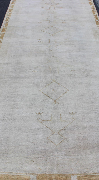 Midcentury vintage Turkish Oushak rug with tribal design in muted tones, rug is - 132, country of origin type: Turkey Oushak, circa mid - 20th century. This Turkish Oushak runner features a multi - medallion tribal design as well as patterns of smalle... - Keivan Woven ArtsIS - 132 - 1462Rug