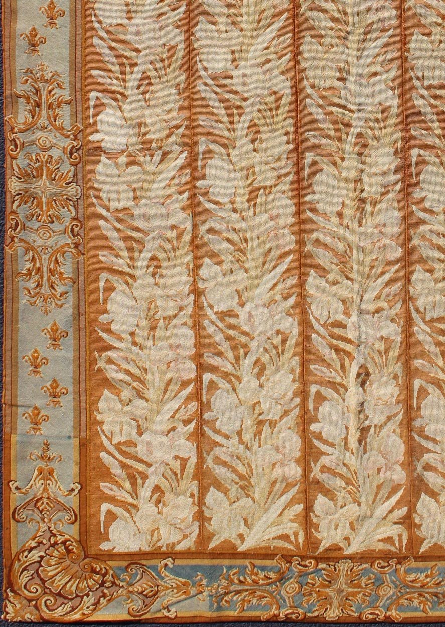 Antique Aubusson Tapestry with Golden Column Panels of Irises This exquisite antique Aubusson tapestry was delicately crafted in France around the middle of the 19th century during the reign of Louis Napoleon Bonaparte. The central body is compo... - Keivan Woven ArtsJ10 - 0801 - 2247Rug