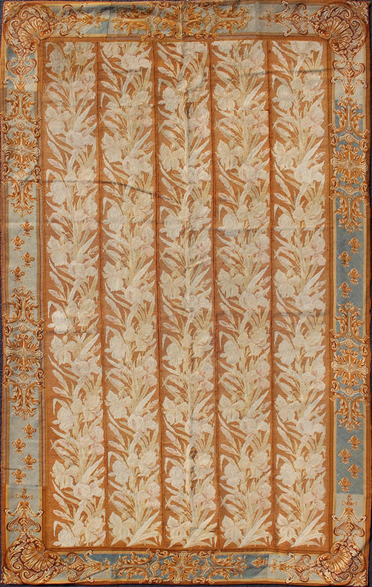 Antique Aubusson Tapestry with Golden Column Panels of Irises This exquisite antique Aubusson tapestry was delicately crafted in France around the middle of the 19th century during the reign of Louis Napoleon Bonaparte. The central body is compo... - Keivan Woven ArtsJ10 - 0801 - 2247Rug