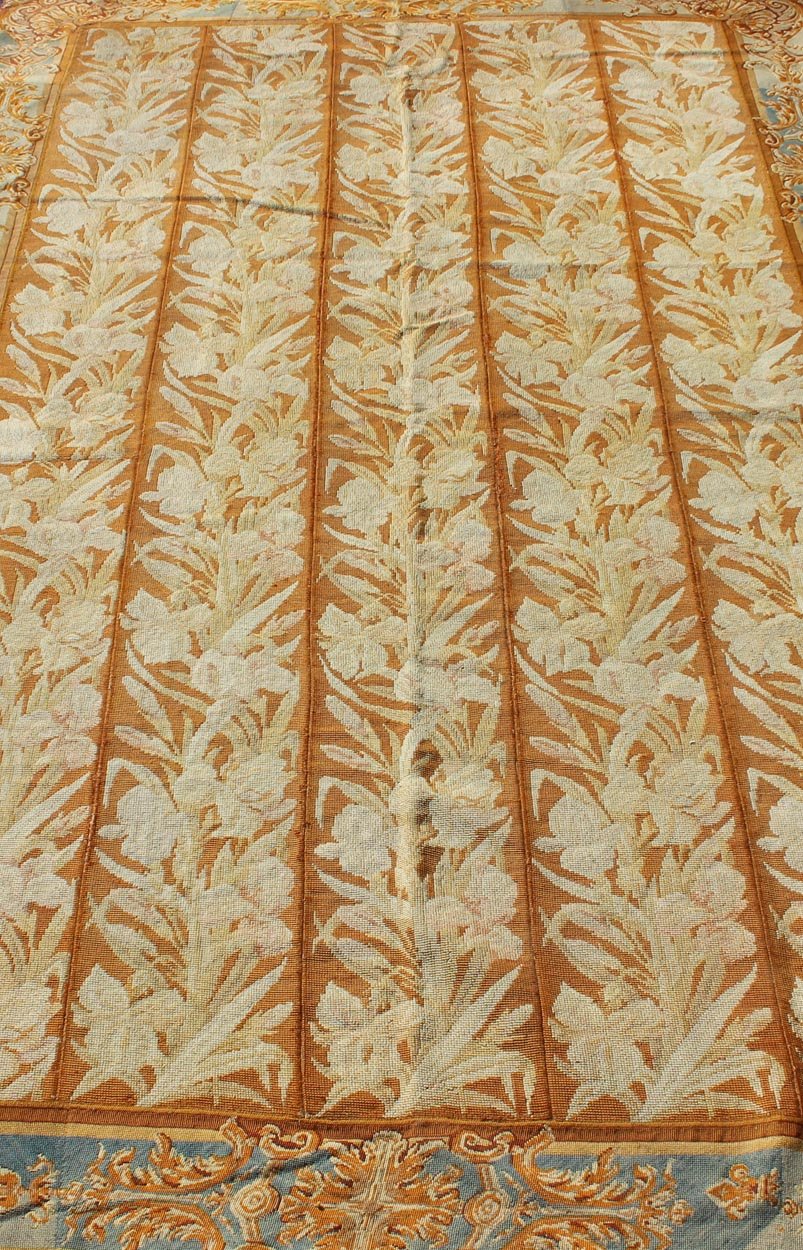 Antique Aubusson Tapestry with Golden Column Panels of Irises This exquisite antique Aubusson tapestry was delicately crafted in France around the middle of the 19th century during the reign of Louis Napoleon Bonaparte. The central body is compo... - Keivan Woven ArtsJ10 - 0801 - 2247Rug