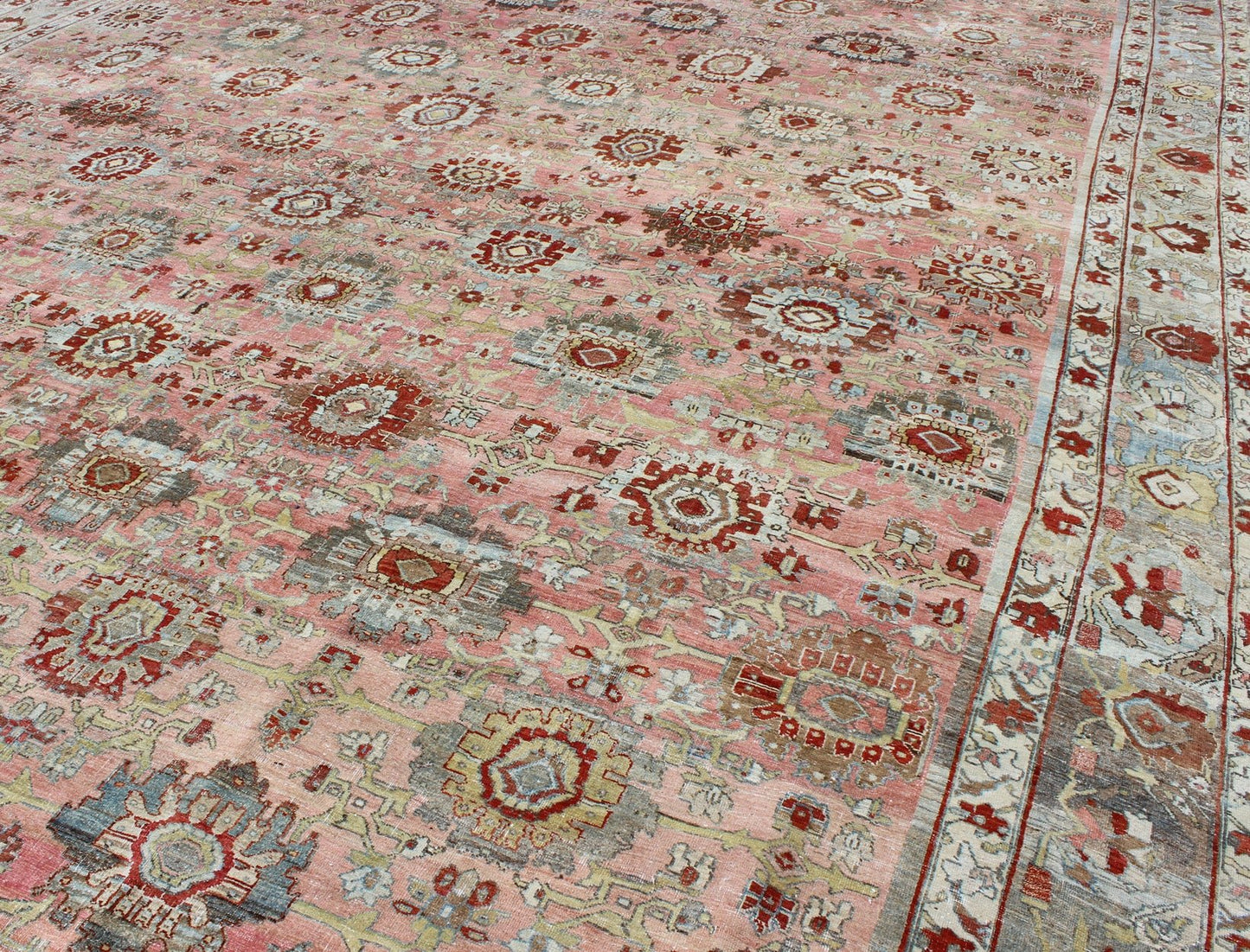 Remarkable antique Persian Bidjar rug with all - over design in light pink, light green and blue. kwarugs J10 - 0805. This magnificent Bidjar with an exquisite, all - over pattern and monumental size rests beautifully on a variegated pink colored backgro... - Keivan Woven ArtsJ10 - 0805 - 1975Rug