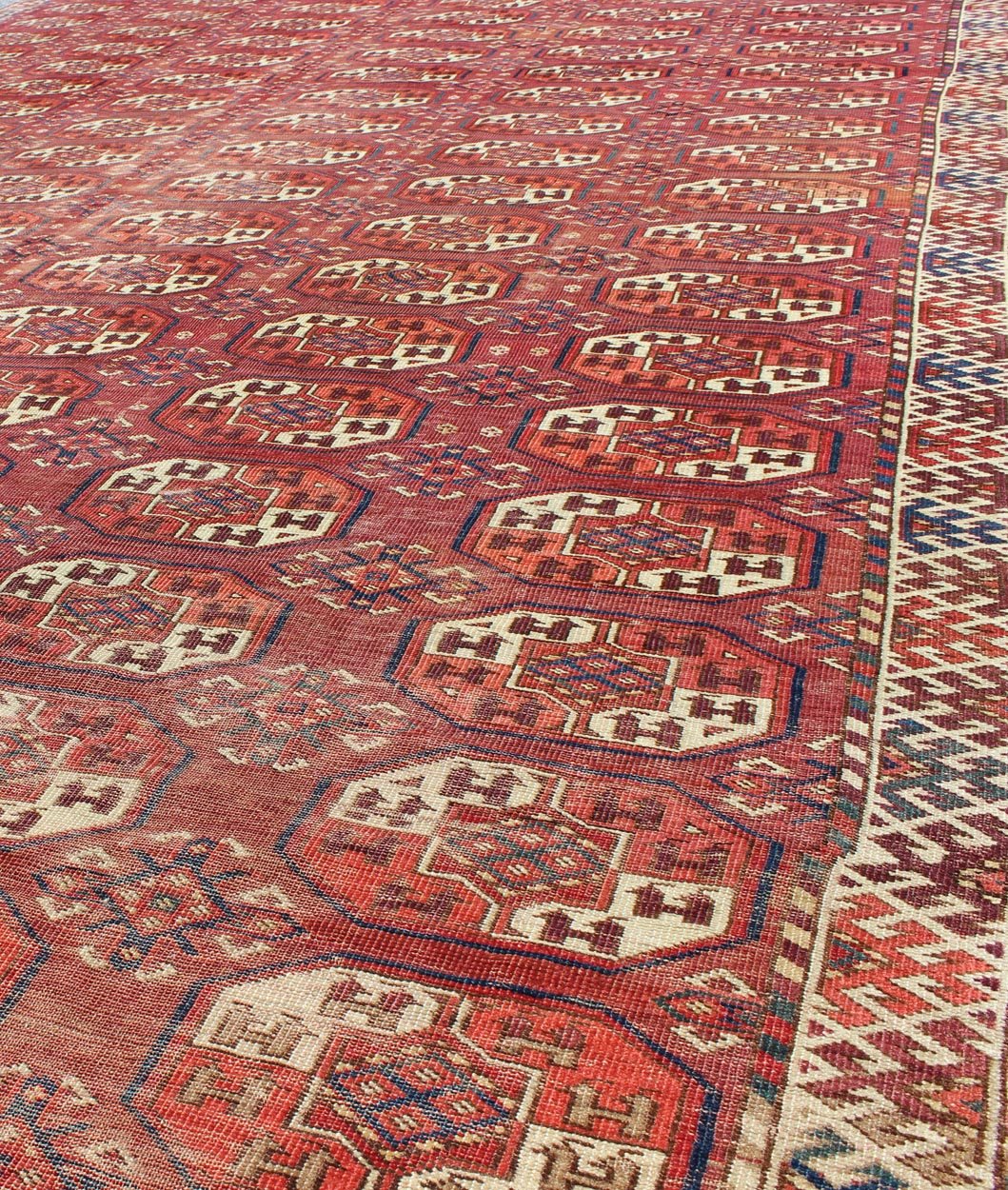 Extremely Large Antique Gallery Rug with Red Field and Repeating Medallion Design. kwarugs J10 - 1105. Long Tekke gallery size. This rare antique Tekke carpet displays warm and delightful red. The field consists motifs with red, orange, medium blu... - Keivan Woven ArtsJ10 - 1105 - 2281Rug
