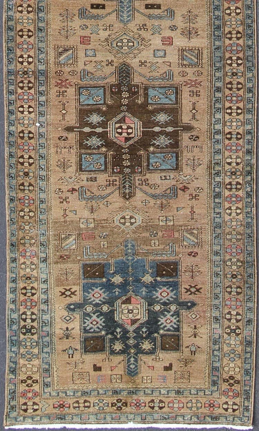Geometric Medallion Heriz Long Antique Runner in Tan, Brown & Blue Geometric Medallion Heriz long antique runner in tan, brown and blue, rug H - 405 - 11, country of origin / type: Heriz, circa 1930. This magnificent antique Persian Heriz carpet from... - Keivan Woven ArtsKB - H - 405 - 11 - 1314Rug