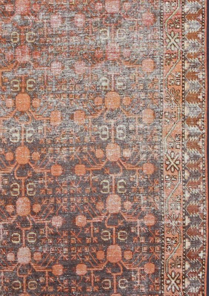 Antique Khotan Carpet An antique, early 20th century, Central Asian Khotan rug with traditional all - over pomegranate pattern on a charcoal field surrounded by multiple complementary floral borders. Measures: 4'11 x 9'9. - Keivan Woven ArtsKBE - 3462 - 7221Rug
