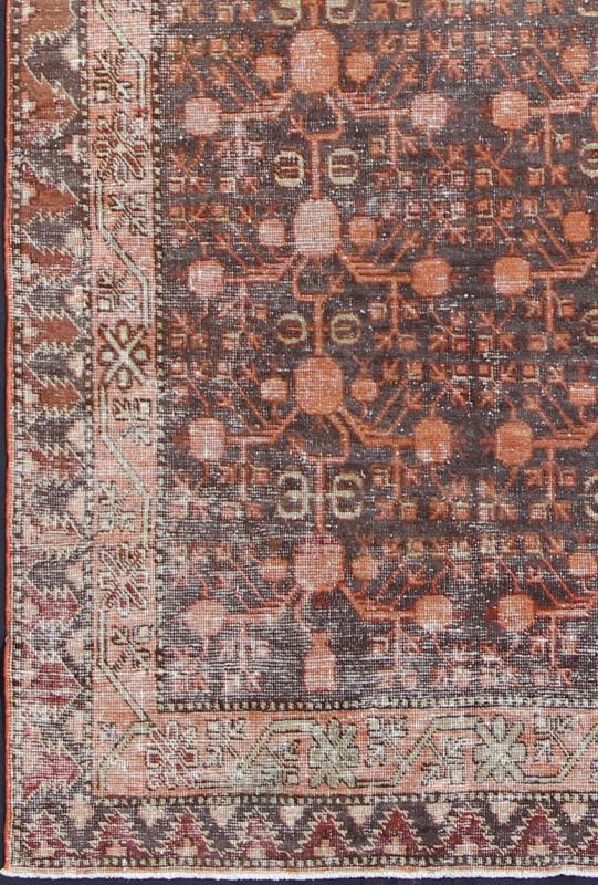 Antique Khotan Carpet An antique, early 20th century, Central Asian Khotan rug with traditional all - over pomegranate pattern on a charcoal field surrounded by multiple complementary floral borders. Measures: 4'11 x 9'9. - Keivan Woven ArtsKBE - 3462 - 7221Rug