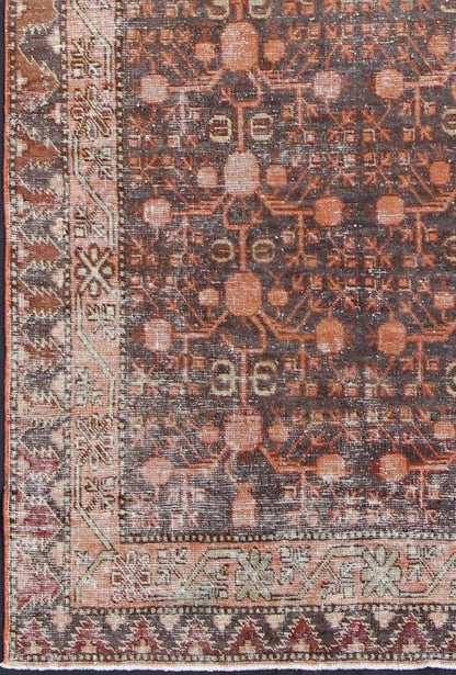 Antique Khotan Carpet An antique, early 20th century, Central Asian Khotan rug with traditional all - over pomegranate pattern on a charcoal field surrounded by multiple complementary floral borders. Measures: 4'11 x 9'9. - Keivan Woven ArtsKBE - 3462 - 7221Rug