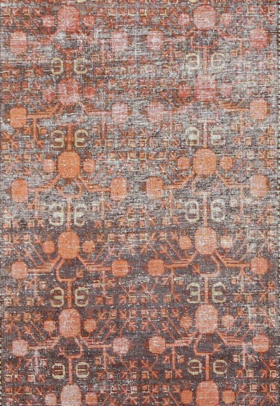 Antique Khotan Carpet An antique, early 20th century, Central Asian Khotan rug with traditional all - over pomegranate pattern on a charcoal field surrounded by multiple complementary floral borders. Measures: 4'11 x 9'9. - Keivan Woven ArtsKBE - 3462 - 7221Rug