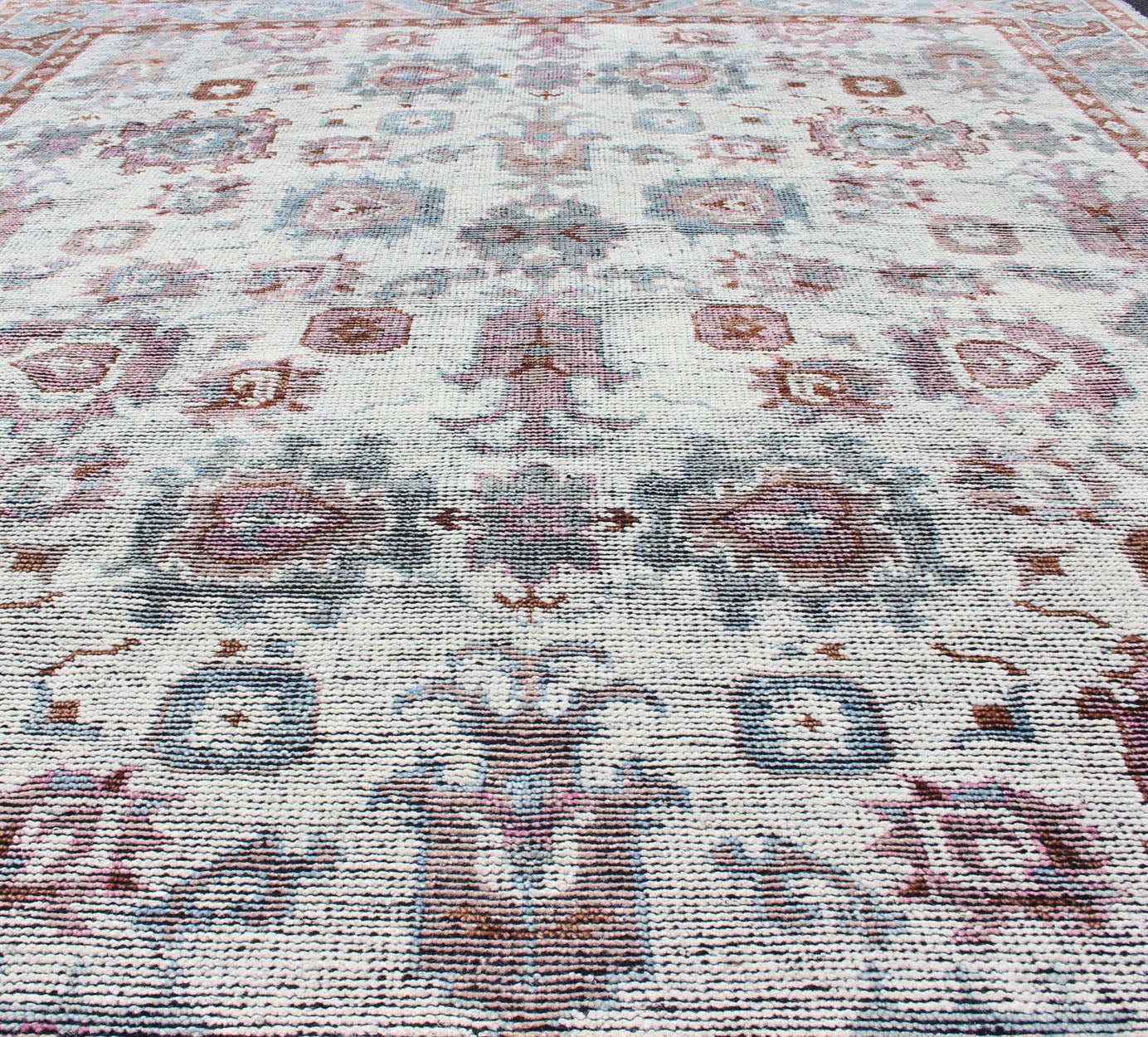 Multi - Colored Transitional Design Distressed Rug in Ivory, Blue, Lavender. Distressed multi colored design Indian piled rug, rug KHN - 1026 - TR - 781, country of origin / type: India / Modern Piled Rug. A unique blend of historical and modern des... - Keivan Woven ArtsKHN - 1026 - TR - 781 - 13540Rug