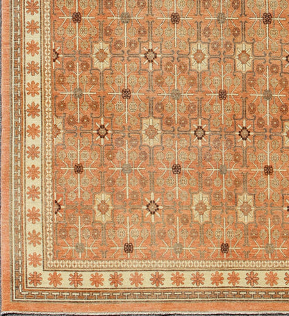 All - Over Design Khotan Rug in Light Tangerine Background. Charcoal, Brown, Green & Taupe Khotan design Rug with all over geometric and square Design in light tangerine background with accent colors of charcoal, brown, green and taupe. rug KOL - 68... - Keivan Woven ArtsKOL - 68165 - 8966Rug