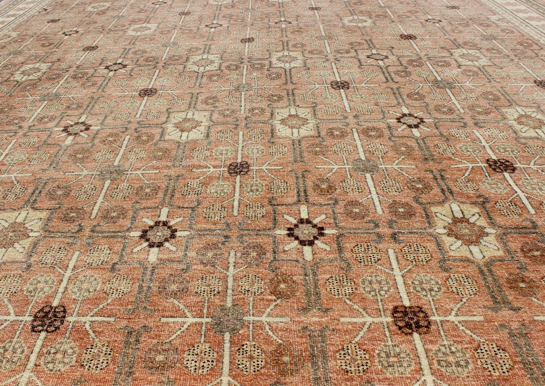 All - Over Design Khotan Rug in Light Tangerine Background. Charcoal, Brown, Green & Taupe Khotan design Rug with all over geometric and square Design in light tangerine background with accent colors of charcoal, brown, green and taupe. rug KOL - 68... - Keivan Woven ArtsKOL - 68165 - 8966Rug