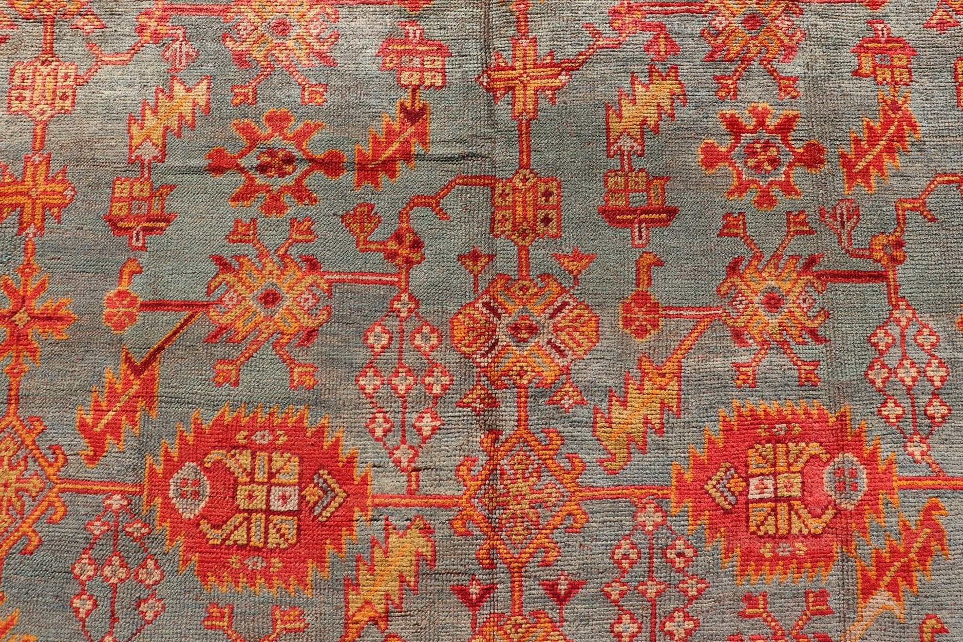 Early 20th century antique Turkish Oushak rug with flowers and geometric motifs in blue background and red border. Keivan Woven Arts / rug L11 - 0404, country of origin / type: Turkey / Oushak, circa 1910 Produced in early 20th century Turkey, thi... - Keivan Woven ArtsL11 - 0404 - 2549Rug