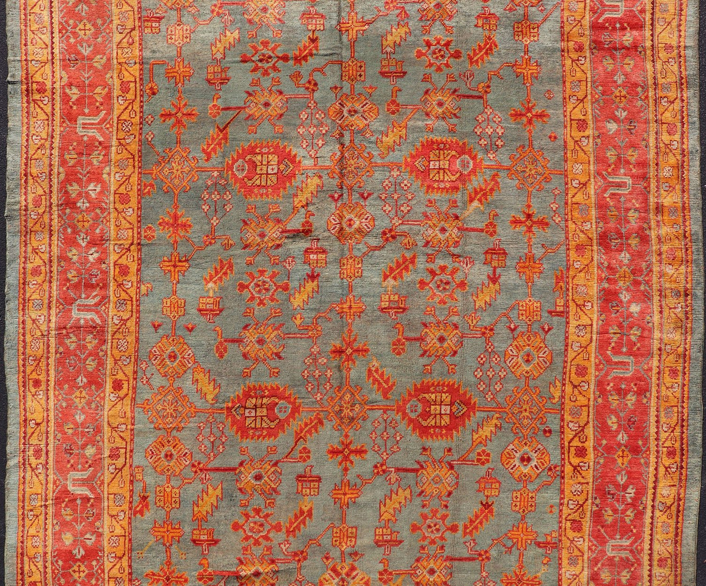 Early 20th century antique Turkish Oushak rug with flowers and geometric motifs in blue background and red border. Keivan Woven Arts / rug L11 - 0404, country of origin / type: Turkey / Oushak, circa 1910 Produced in early 20th century Turkey, thi... - Keivan Woven ArtsL11 - 0404 - 2549Rug