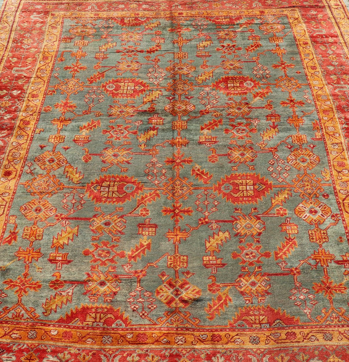 Early 20th century antique Turkish Oushak rug with flowers and geometric motifs in blue background and red border. Keivan Woven Arts / rug L11 - 0404, country of origin / type: Turkey / Oushak, circa 1910 Produced in early 20th century Turkey, thi... - Keivan Woven ArtsL11 - 0404 - 2549Rug