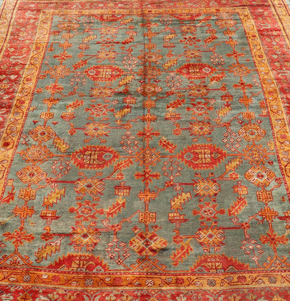 Early 20th century antique Turkish Oushak rug with flowers and geometric motifs in blue background and red border. Keivan Woven Arts / rug L11 - 0404, country of origin / type: Turkey / Oushak, circa 1910 Produced in early 20th century Turkey, thi... - Keivan Woven ArtsL11 - 0404 - 2549Rug