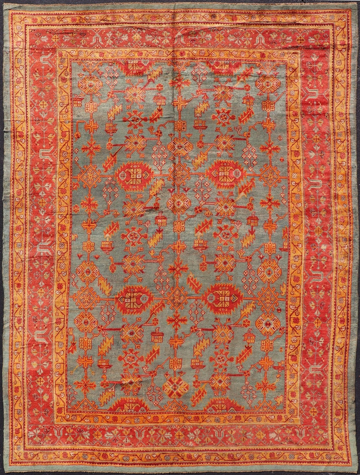 Early 20th century antique Turkish Oushak rug with flowers and geometric motifs in blue background and red border. Keivan Woven Arts / rug L11 - 0404, country of origin / type: Turkey / Oushak, circa 1910 Produced in early 20th century Turkey, thi... - Keivan Woven ArtsL11 - 0404 - 2549Rug