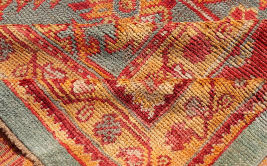 Early 20th century antique Turkish Oushak rug with flowers and geometric motifs in blue background and red border. Keivan Woven Arts / rug L11 - 0404, country of origin / type: Turkey / Oushak, circa 1910 Produced in early 20th century Turkey, thi... - Keivan Woven ArtsL11 - 0404 - 2549Rug