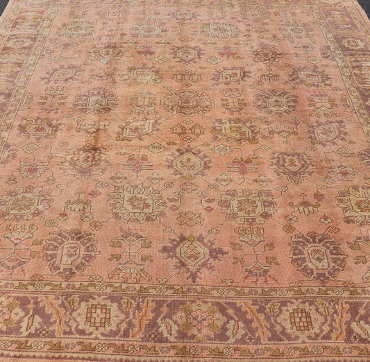 Antique Turkish Oushak Rug with Floral Motifs in Lavender, Coral - Pink, and Green. Keivan Woven Arts / rug L11 - 0406, country of origin / type: Turkey / Oushak, circa Early - 20th century Measures: 8'10 x 11'5. This unique Turkish Oushak carpet featu... - Keivan Woven ArtsL11 - 0406 - 2561Rug
