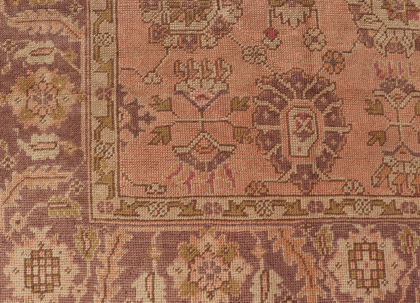 Antique Turkish Oushak Rug with Floral Motifs in Lavender, Coral - Pink, and Green. Keivan Woven Arts / rug L11 - 0406, country of origin / type: Turkey / Oushak, circa Early - 20th century Measures: 8'10 x 11'5. This unique Turkish Oushak carpet featu... - Keivan Woven ArtsL11 - 0406 - 2561Rug