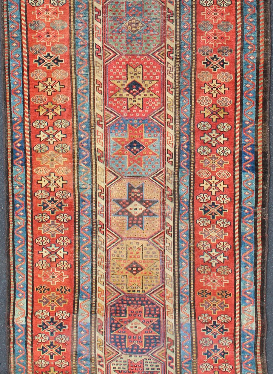 Antique Caucasian Kazak Runner with Medallions in Red, Blue, and Yellow. Keivan Woven Arts / rug L11 - 1205, country of origin / type: Iran / Tribal, circa 1900 Measures: 3'6 x 16. This antique Caucasian Kazak runner features multiple repeating med... - Keivan Woven ArtsL11 - 1205 - 7409Rug