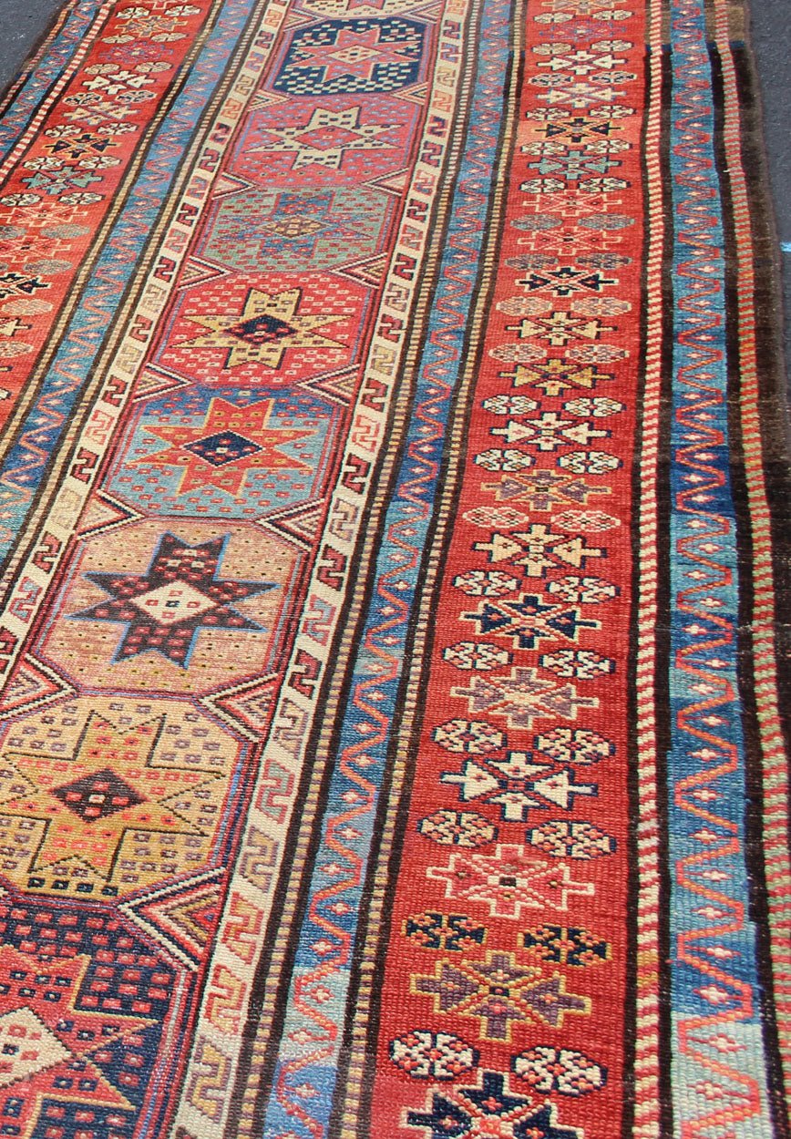 Antique Caucasian Kazak Runner with Medallions in Red, Blue, and Yellow. Keivan Woven Arts / rug L11 - 1205, country of origin / type: Iran / Tribal, circa 1900 Measures: 3'6 x 16. This antique Caucasian Kazak runner features multiple repeating med... - Keivan Woven ArtsL11 - 1205 - 7409Rug