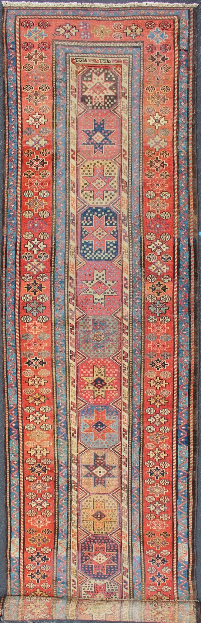 Antique Caucasian Kazak Runner with Medallions in Red, Blue, and Yellow. Keivan Woven Arts / rug L11 - 1205, country of origin / type: Iran / Tribal, circa 1900 Measures: 3'6 x 16. This antique Caucasian Kazak runner features multiple repeating med... - Keivan Woven ArtsL11 - 1205 - 7409Rug