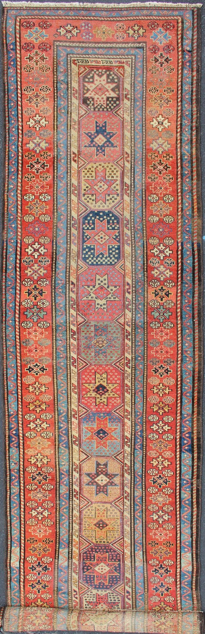 Antique Caucasian Kazak Runner with Medallions in Red, Blue, and Yellow. Keivan Woven Arts / rug L11 - 1205, country of origin / type: Iran / Tribal, circa 1900 Measures: 3'6 x 16. This antique Caucasian Kazak runner features multiple repeating med... - Keivan Woven ArtsL11 - 1205 - 7409Rug