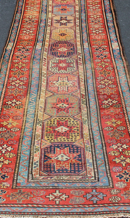 Antique Caucasian Kazak Runner with Medallions in Red, Blue, and Yellow. Keivan Woven Arts / rug L11 - 1205, country of origin / type: Iran / Tribal, circa 1900 Measures: 3'6 x 16. This antique Caucasian Kazak runner features multiple repeating med... - Keivan Woven ArtsL11 - 1205 - 7409Rug