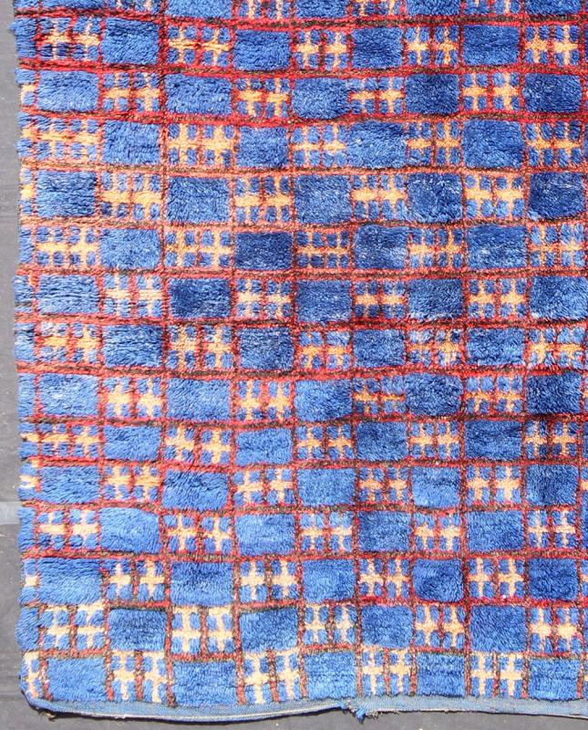 Vintage Moroccan Rug This unique vintage Moroccan carpet is characterized by a saturated, bold blue color and dramatic berber symbols. The alternating checkerboard pattern is outlined in red with tan cross motifs while its thick pile has a soft ... - Keivan Woven ArtsLCB - 136601 - 7309Rug