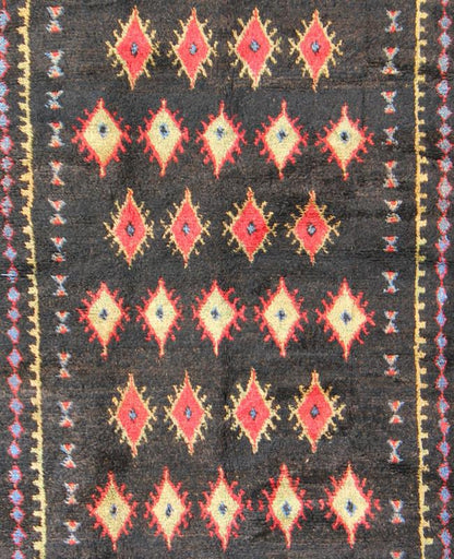 Charcoal Black Background Unique Vintage Moroccan Rug in Red and Yellow Measures: 4'9'' x 9'10''. Featuring a central charcoal field full of red and yellow diamond - shaped motifs, this unique Moroccan rug displays a harmonious and rich color p... - Keivan Woven ArtsLCB - 136610 - 7321Rug