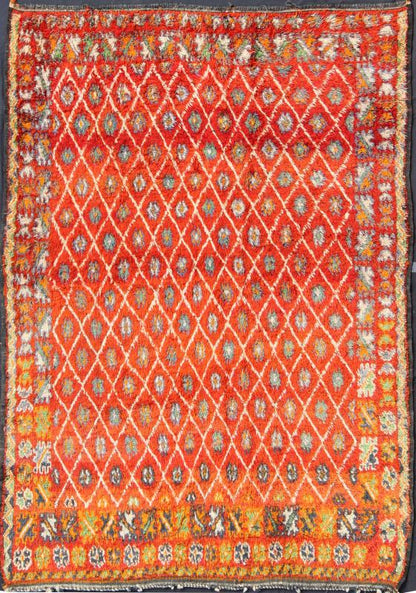 Orange and Red Background Vintage Moroccan Rug with All - Over Diamond Pattern Measures: 6'9'' x 9'0''. This Moroccan rug has an all - over diamond geometric pattern with ivory outlines, set on a field shaded with orange and red. The border featu... - Keivan Woven ArtsLCB - 136641 - 7333Rug