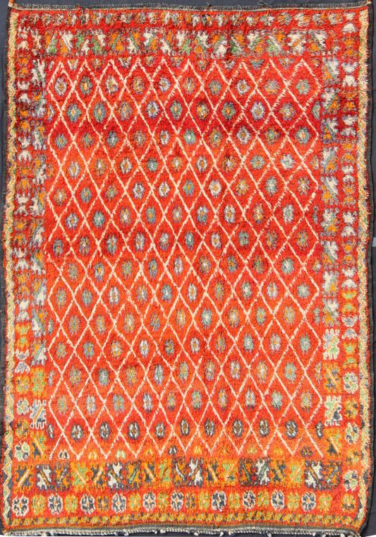 Orange and Red Background Vintage Moroccan Rug with All - Over Diamond Pattern Measures: 6'9'' x 9'0''. This Moroccan rug has an all - over diamond geometric pattern with ivory outlines, set on a field shaded with orange and red. The border featu... - Keivan Woven ArtsLCB - 136641 - 7333Rug