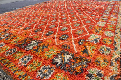 Orange and Red Background Vintage Moroccan Rug with All - Over Diamond Pattern Measures: 6'9'' x 9'0''. This Moroccan rug has an all - over diamond geometric pattern with ivory outlines, set on a field shaded with orange and red. The border featu... - Keivan Woven ArtsLCB - 136641 - 7333Rug
