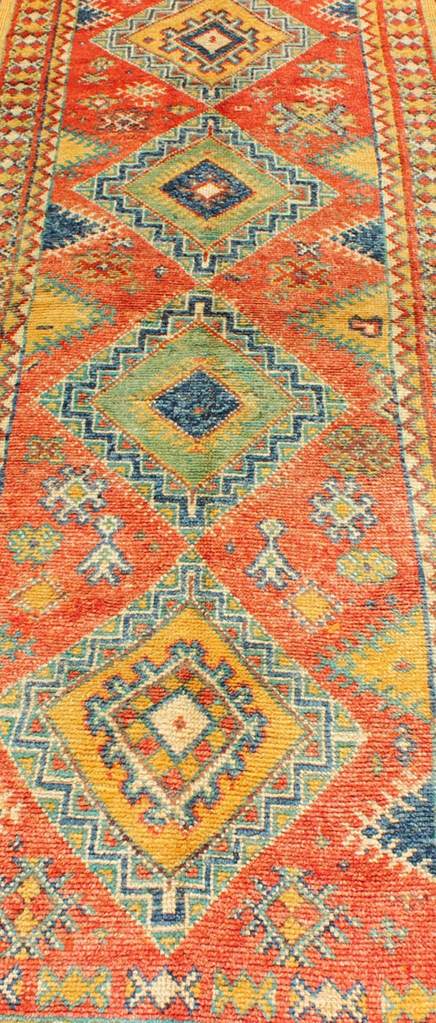 Colorful Moroccan Runner in Orange, Blue, Yellow and Gold Colors. Keivan Woven Arts / rug LCB - 571, country of origin / type: Morocco / Tribal, circa 1950 Rendered with four medallions and random shapes of spotted and speckled with an assortment ... - Keivan Woven ArtsLCB - 571 - 5301Rug