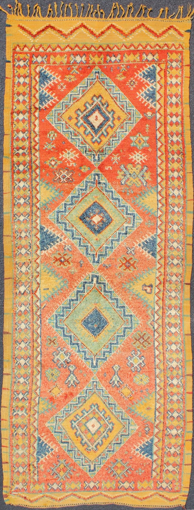 Colorful Moroccan Runner in Orange, Blue, Yellow and Gold Colors. Keivan Woven Arts / rug LCB - 571, country of origin / type: Morocco / Tribal, circa 1950 Rendered with four medallions and random shapes of spotted and speckled with an assortment ... - Keivan Woven ArtsLCB - 571 - 5301Rug
