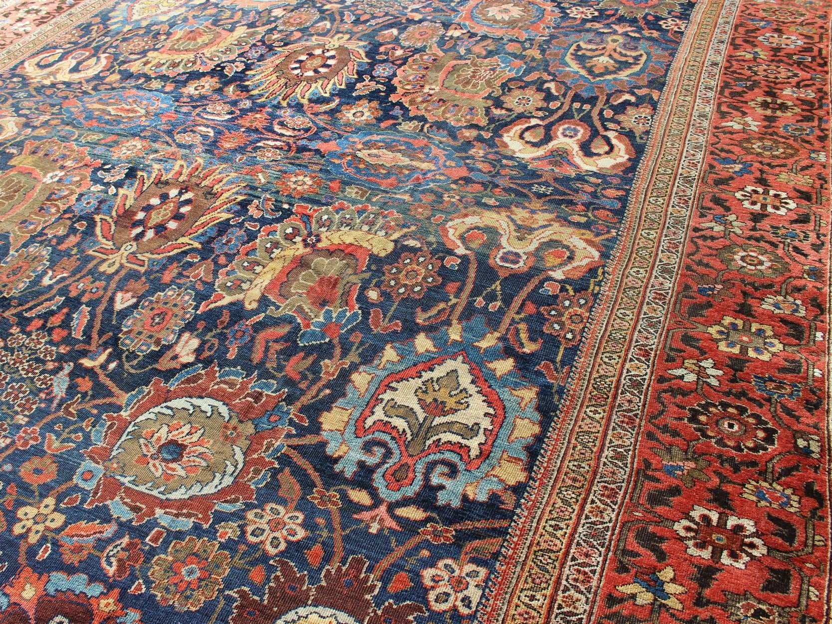 Exceptional Large Antique Sultanabad Rug in Midnight Blue and Coral Red. Keivan Woven Arts / rug M14 - 0305, country of origin / type: Iran / Sultanabad, circa 1900. Measure: 13.1 x 17.1. This exceptional antique Sultanabad showcases a marvelous l... - Keivan Woven ArtsM14 - 0305 - 6320Rug