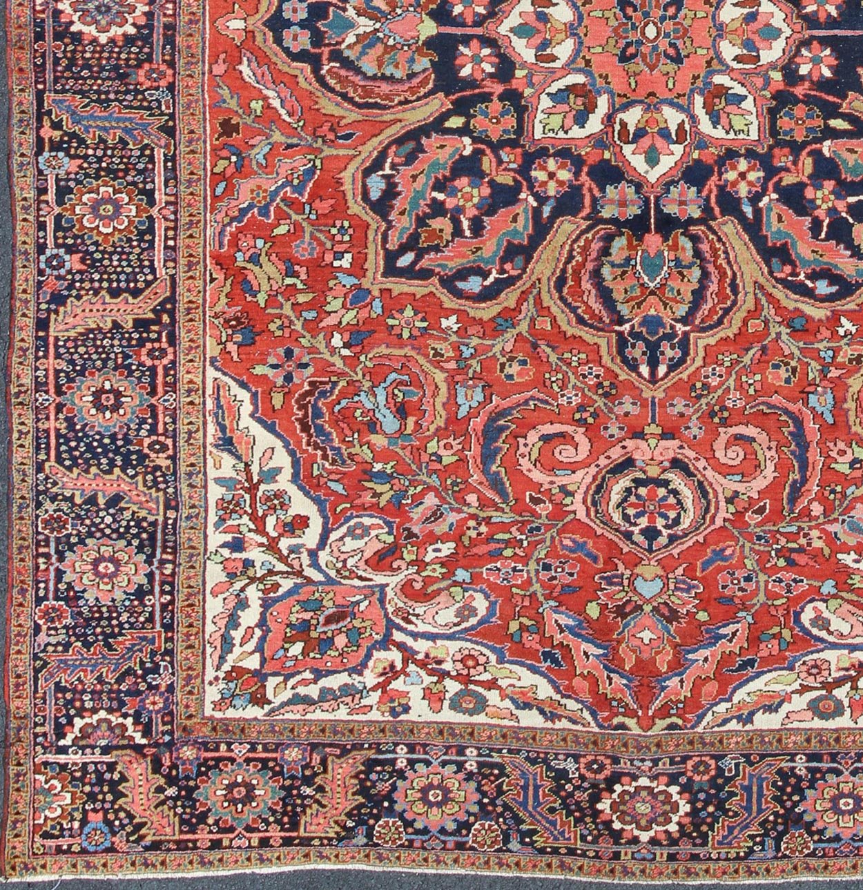 Large Persian Heriz Rug with Geometric Medallion in Rust, Pink, Green and Blue. Keivan Woven Arts / Rug / M14 - 0501, country of origin / type: Iran /Heriz, circa 1930. Measures: 10'1 x 13'5. Masterful craftsmanship and a strong tribal design make... - Keivan Woven ArtsM14 - 0501 - 5371Rug