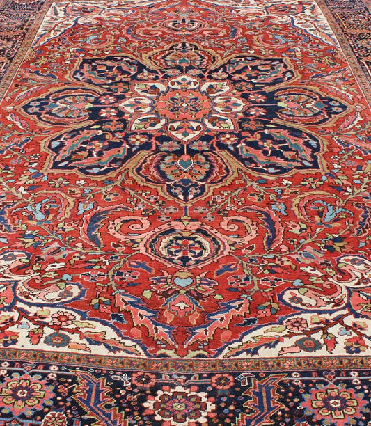 Large Persian Heriz Rug with Geometric Medallion in Rust, Pink, Green and Blue. Keivan Woven Arts / Rug / M14 - 0501, country of origin / type: Iran /Heriz, circa 1930. Measures: 10'1 x 13'5. Masterful craftsmanship and a strong tribal design make... - Keivan Woven ArtsM14 - 0501 - 5371Rug