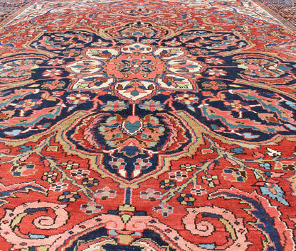 Large Persian Heriz Rug with Geometric Medallion in Rust, Pink, Green and Blue. Keivan Woven Arts / Rug / M14 - 0501, country of origin / type: Iran /Heriz, circa 1930. Measures: 10'1 x 13'5. Masterful craftsmanship and a strong tribal design make... - Keivan Woven ArtsM14 - 0501 - 5371Rug