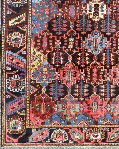 Vintage Persian Bakhtiari Rug This vintage Bakhtiari has an all - over garden pattern. The repeating border of flowers and vines include yellow, blue and red set on a brown background. Measures: 7'3 x 9'7. - Keivan Woven ArtsM14 - 0514 - 5385Rug