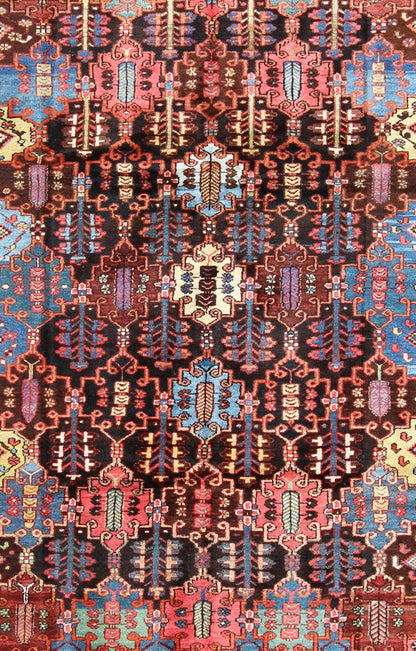 Vintage Persian Bakhtiari Rug This vintage Bakhtiari has an all - over garden pattern. The repeating border of flowers and vines include yellow, blue and red set on a brown background. Measures: 7'3 x 9'7. - Keivan Woven ArtsM14 - 0514 - 5385Rug
