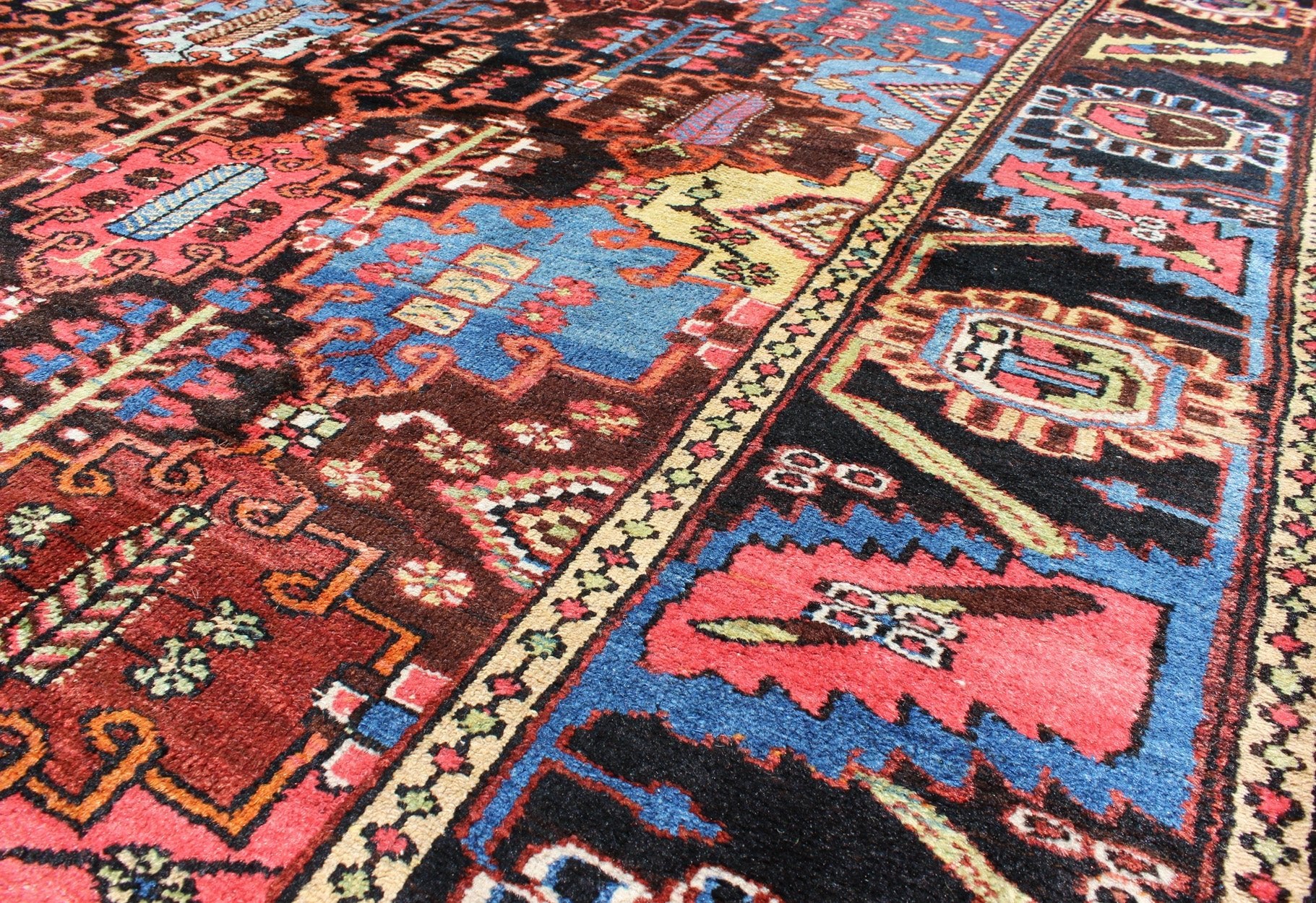 Vintage Persian Bakhtiari Rug This vintage Bakhtiari has an all - over garden pattern. The repeating border of flowers and vines include yellow, blue and red set on a brown background. Measures: 7'3 x 9'7. - Keivan Woven ArtsM14 - 0514 - 5385Rug