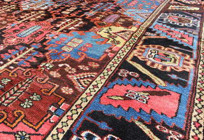 Vintage Persian Bakhtiari Rug This vintage Bakhtiari has an all - over garden pattern. The repeating border of flowers and vines include yellow, blue and red set on a brown background. Measures: 7'3 x 9'7. - Keivan Woven ArtsM14 - 0514 - 5385Rug