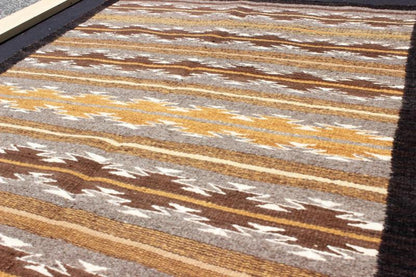Earthy Tones USA Navajo Kilim rug with Black Border Tribal Design 1940s Navajo Tribal Kilim with geometric design in Marigold, grey and black rug M14 - 0902, country of origin / type: America / Navajo, circa 1940 This intriguing antique Nav... - Keivan Woven ArtsM14 - 0902 - 5930Rug